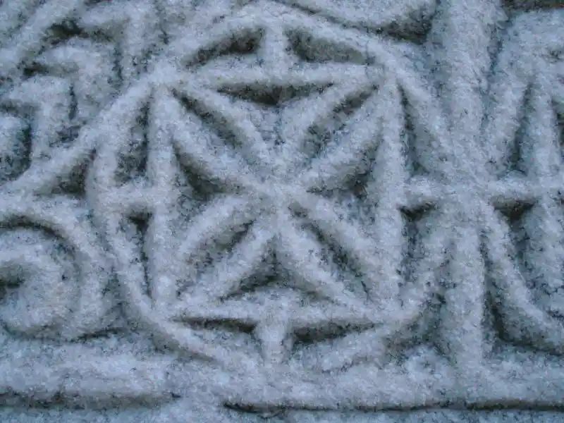 Geometrically derived cross carvings on a marble stone